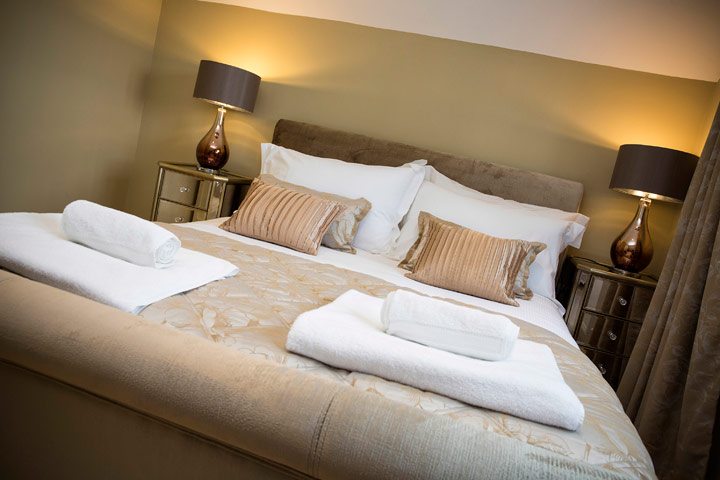 Photo of the master bedroom at River Cottage